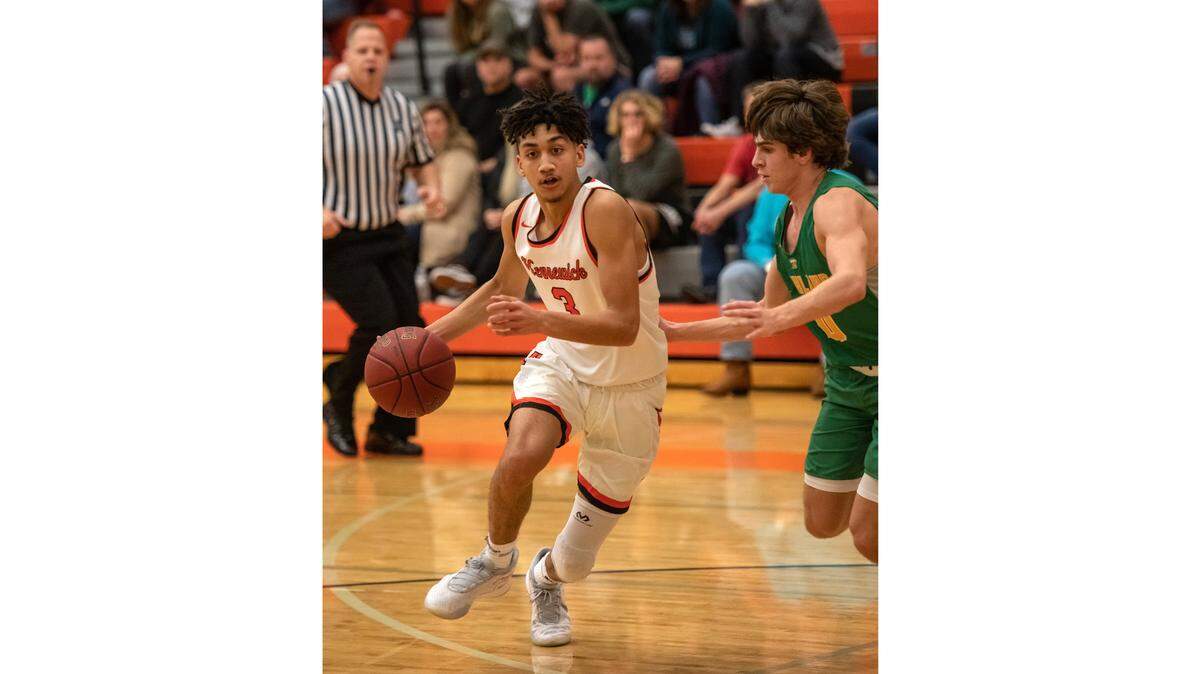 Kennewick senior Ayoni Benavidez drives around a Richland player in a recent game.