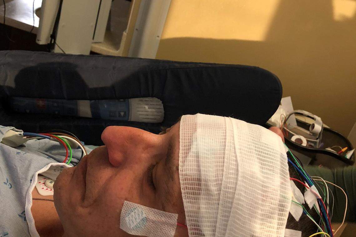 Bill Evans of Richland is treated after one of his frequents seizures.