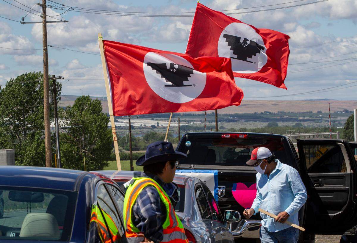 On Friday, people wanting to show support for the workers from the Tyson Plant in Walla Walla County parked outside of the plant on Dodd Road to wave signs, honk car horns and pay respect to three employees from the plant who died after contracting coronavirus.