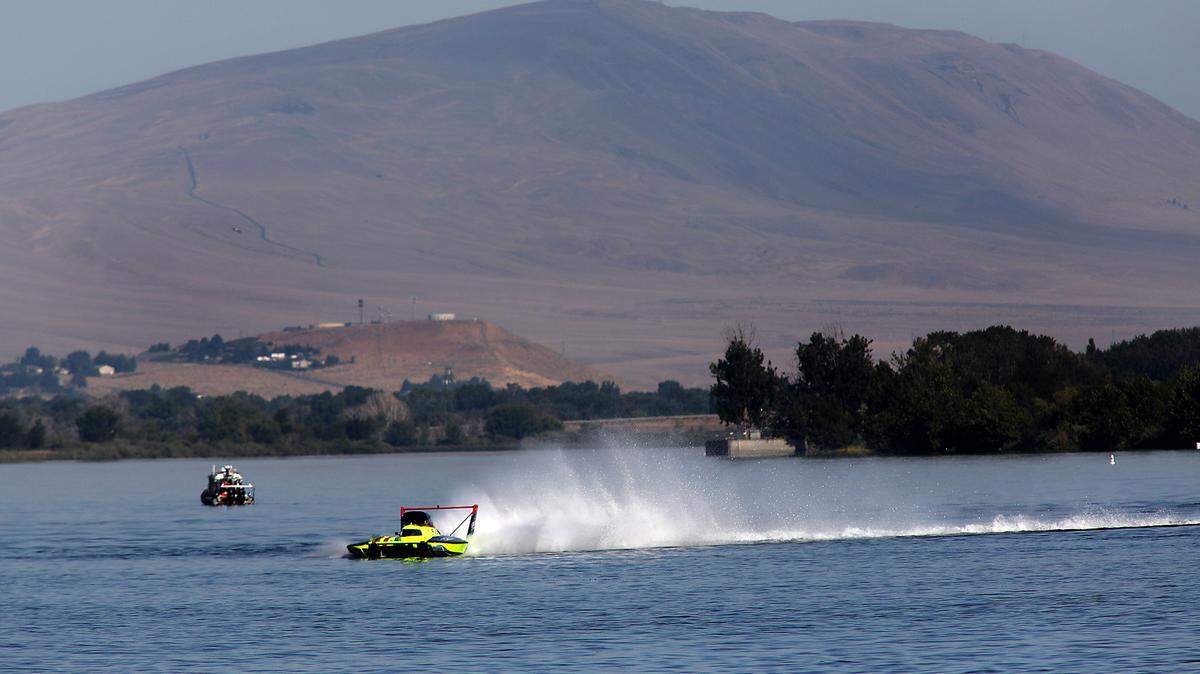 Rattlesnake Mountain looms large as driver Jamie Nilsen pilots the U-11 Legend Yacht Transport presented by The Truss Company unlimited hydroplane around the Columbia River during Friday morning’s opening testing session.