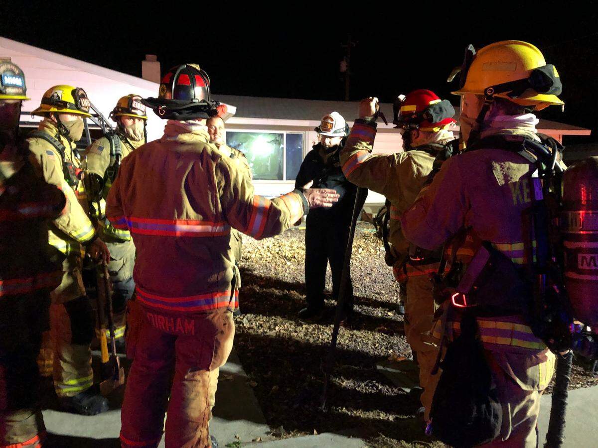 Kennewick firefighters found a woman dead inside a house that was on fire.