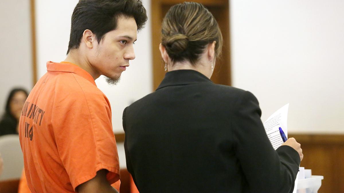Moses Balderas, 19, discusses court papers with his defense attorney Danielle Purcell during his arraignment Tuesday in Franklin County Superior Court in Pasco.