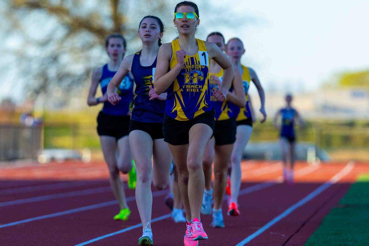 Hanford and Southridge athletes run during a March 26 track and field meet.