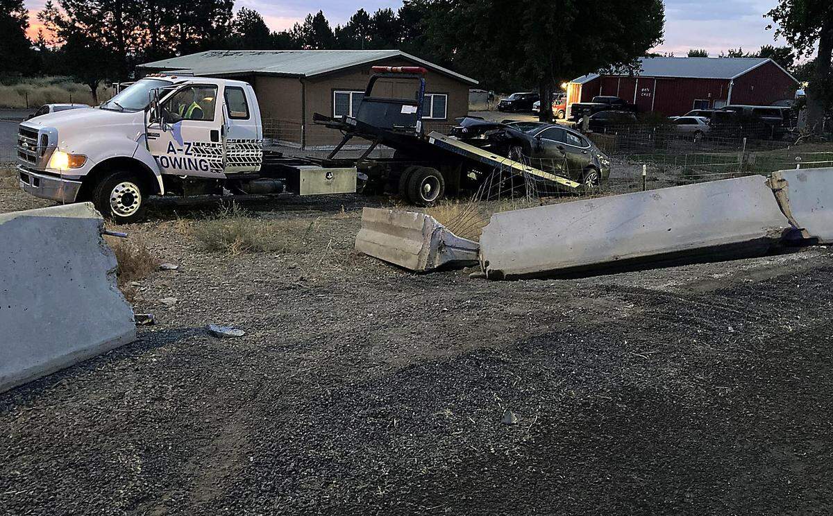 A suspected drunk driver ran from the scene of a crash at the corner of East Third Avenue and Yew Street leaving two hurt passengers behind. 