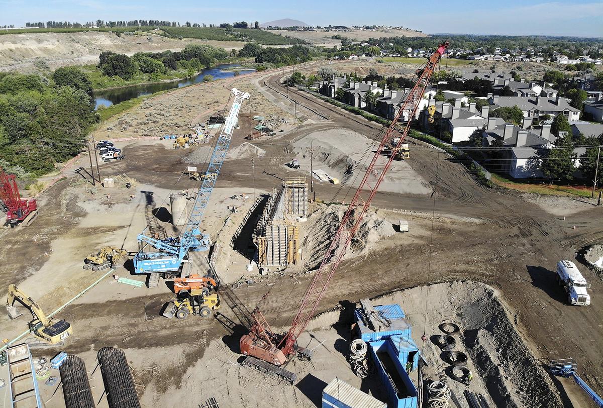 Crews work on the future Duportail Bridge on the north side of the Yakima River in Richland. The estimated $38 million project will link Richland's waterfront, central business district and Queensgate areas. Watch a video at: tricityherald.com/video