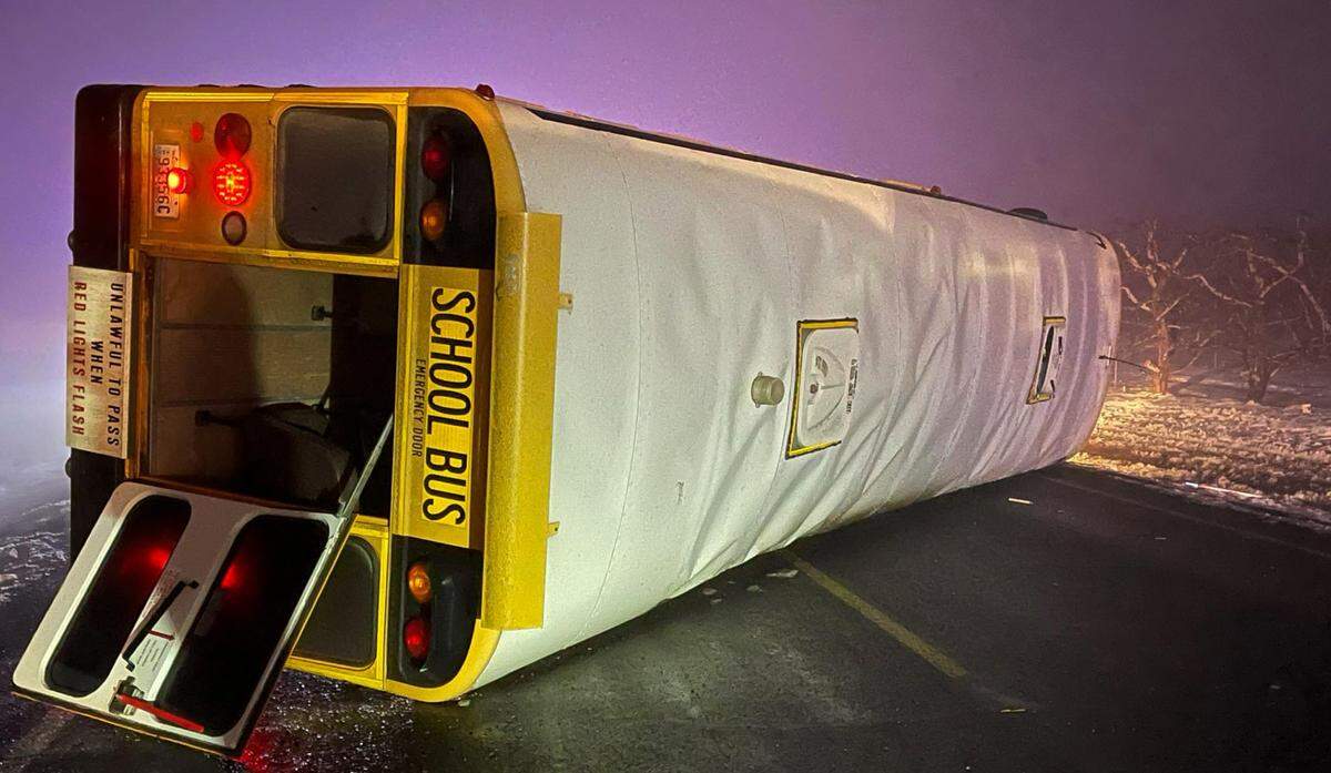 A Wahluke School District school bus flipped Monday after being hit by a pickup truck in rural Grant County north of the Hanford site.