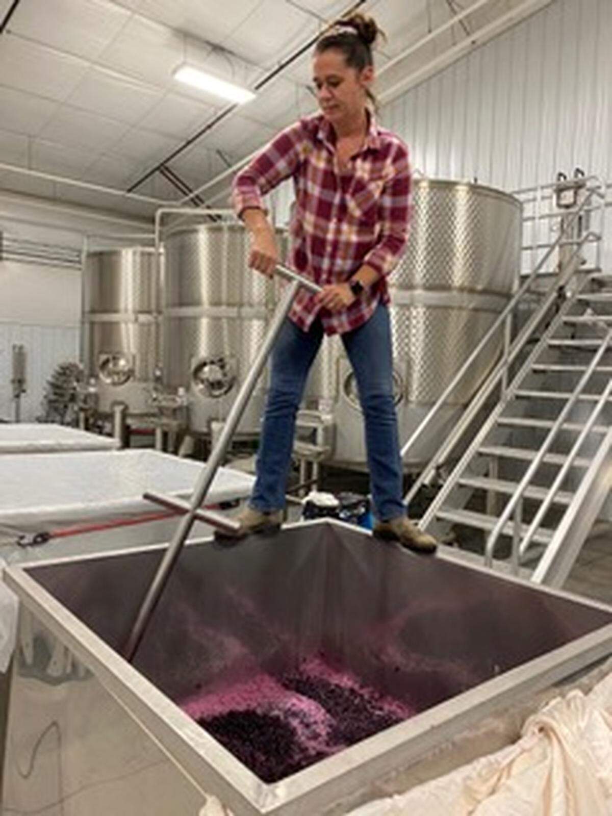 Amy Johnson of Muret-Gaston Wines works in her winery.