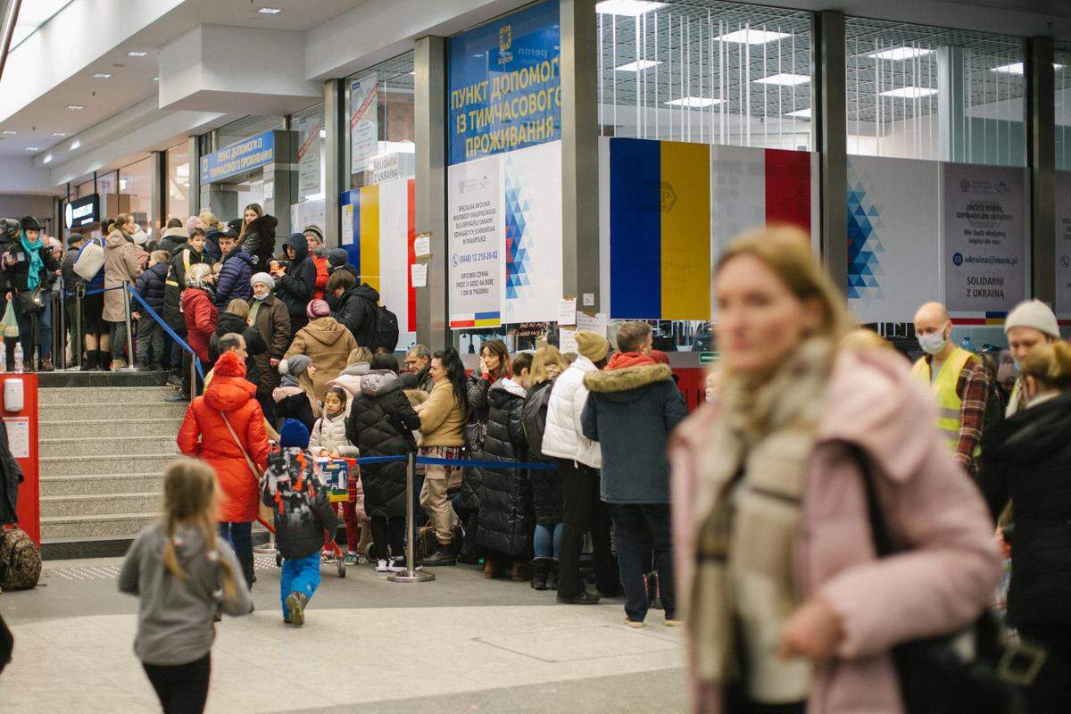 Hundreds of Ukrainian refugees line up on March 9 after arriving at a train station in Krakow, Poland in this photo taken by Avel Chuklanov. Many slept in the station, while others departed.