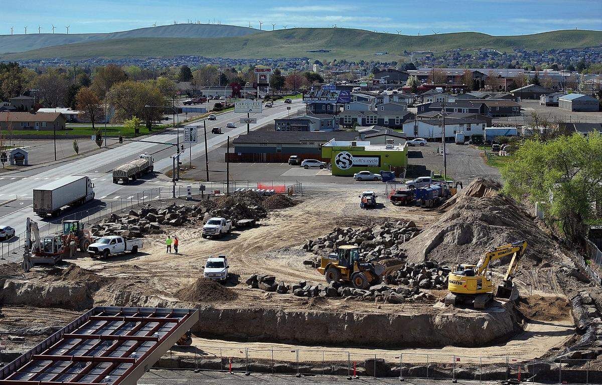 A $300,000 retaining wall is being built for the Surf Thru Express Car Wash off Highway 395 in Kennewick. The new automated car wash is the second of three in the Tri-Cities.