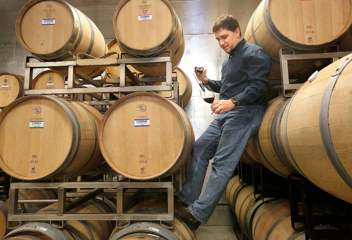Jay Krutulis of Prospice Wines uses a wine thief to draw a sample from one of two vintages the new business has in barrels at their facility on Port of Walla Walla land near the airport. Watch a video at: tricityherald.com/video
