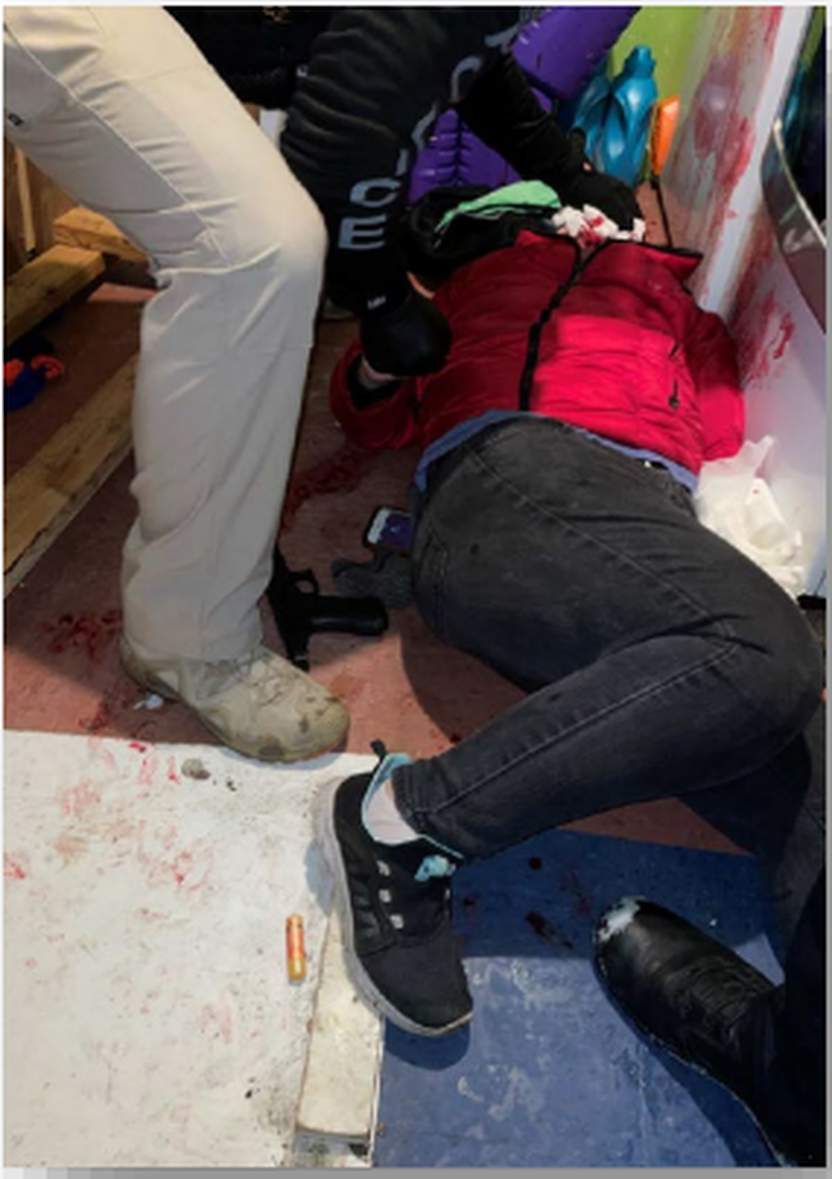 Maria Vargas-Gomez lies bleeding on the floor of her laundry room after police responded to a domestic violence incident at a Pasco mobile home.