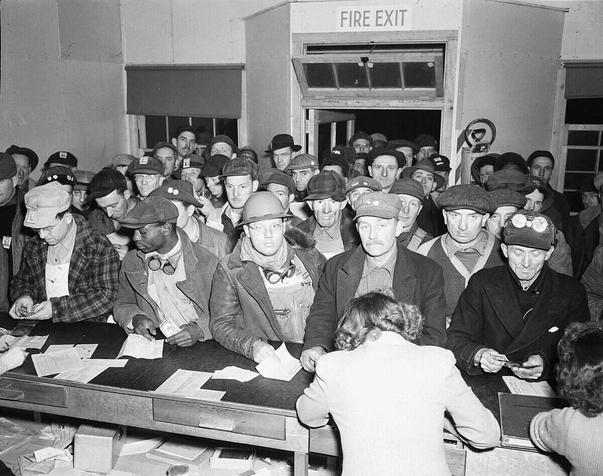 The Western Union office at Hanford was packed on a 1944 pay day with men waiting to send money home. Other photos show the line stretching outside.