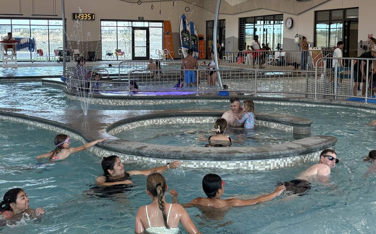 Families swim in the lazy river indoor the facility at the Pasco Aquatic Center on Saturday, June 27.