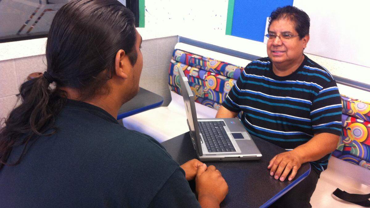 McDonald's patron Nato Orozco (left) graciously helps illustrate Tony Aguilar’s ministry.
