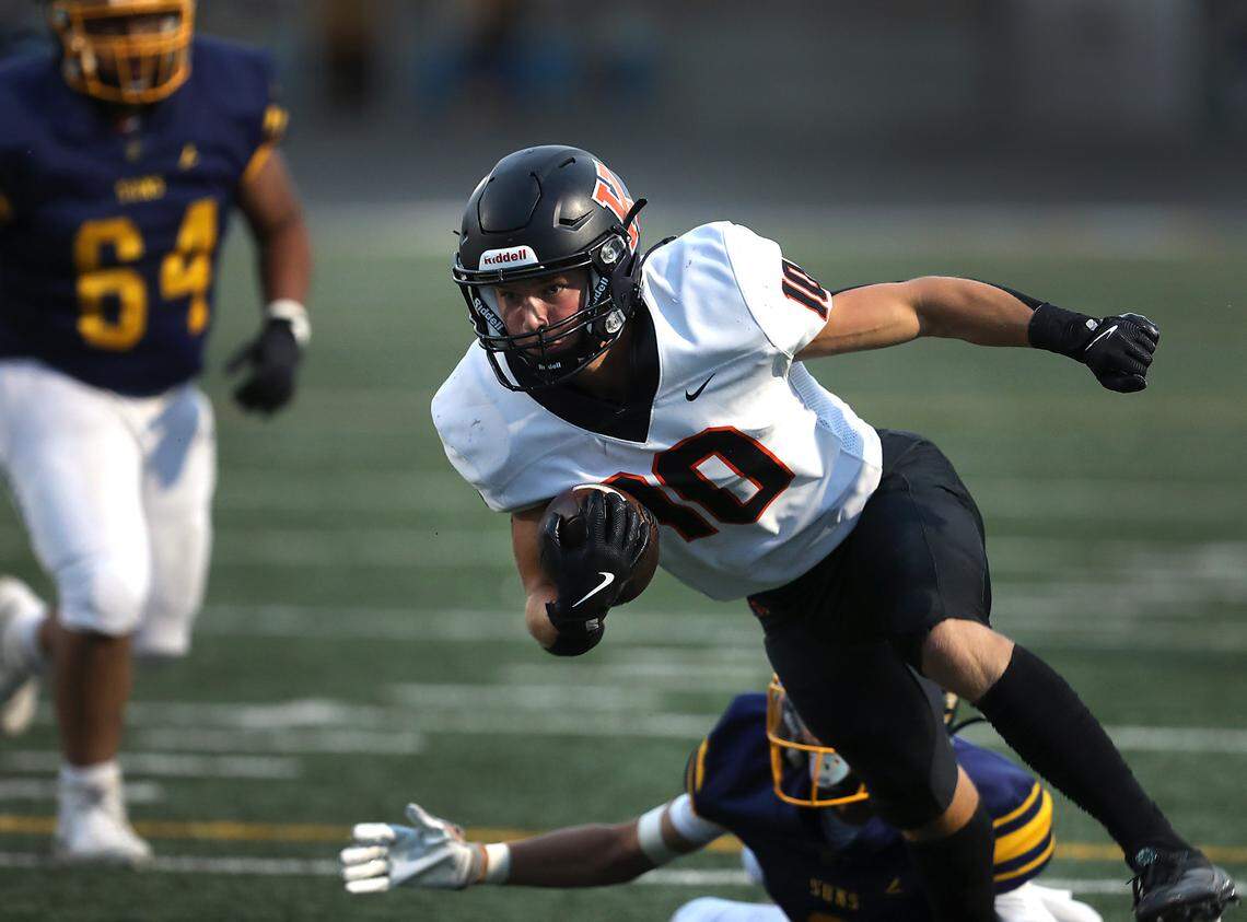 Kennewick running back Canaan Hays stays low to ground after fighting off a Southridge defender during a run Sept. 13, 2024 at Lampson Stadium in Kennewick.