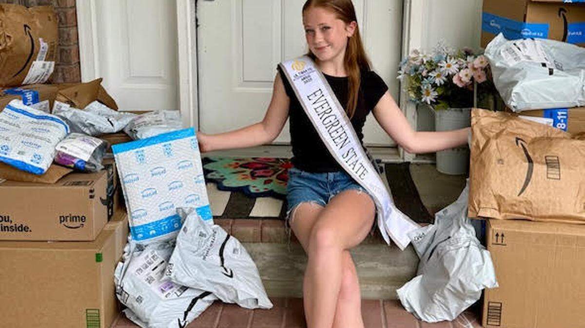 Rhylinn Simmons with amazon packages for Dignity Duffles