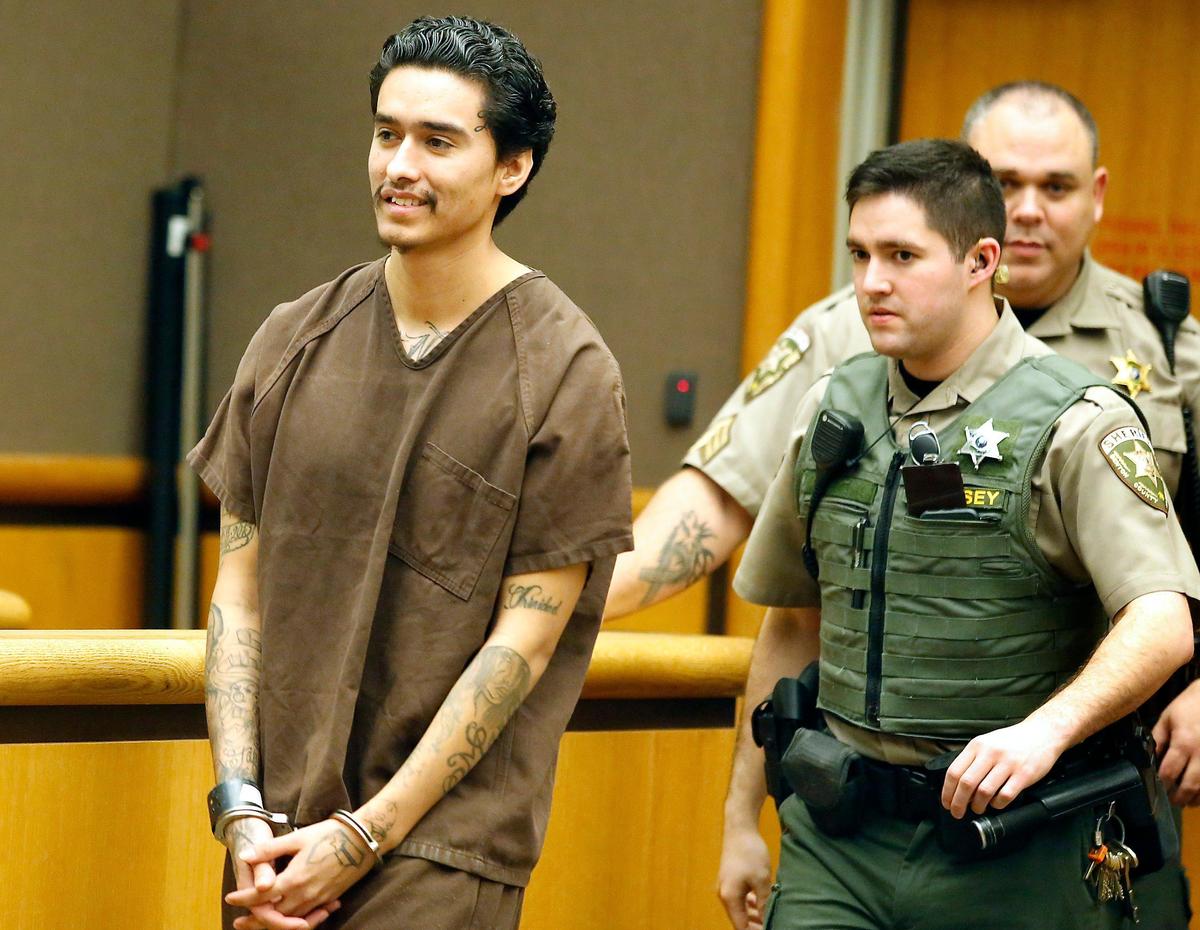 Carlos Tapia Torres is escorted into Benton County Superior Court Friday where he plead guilty to first-degree rendering criminal assistance in connection to the Sept. 11, 2017, shooting death of Martin Ibanez in Kennewick.