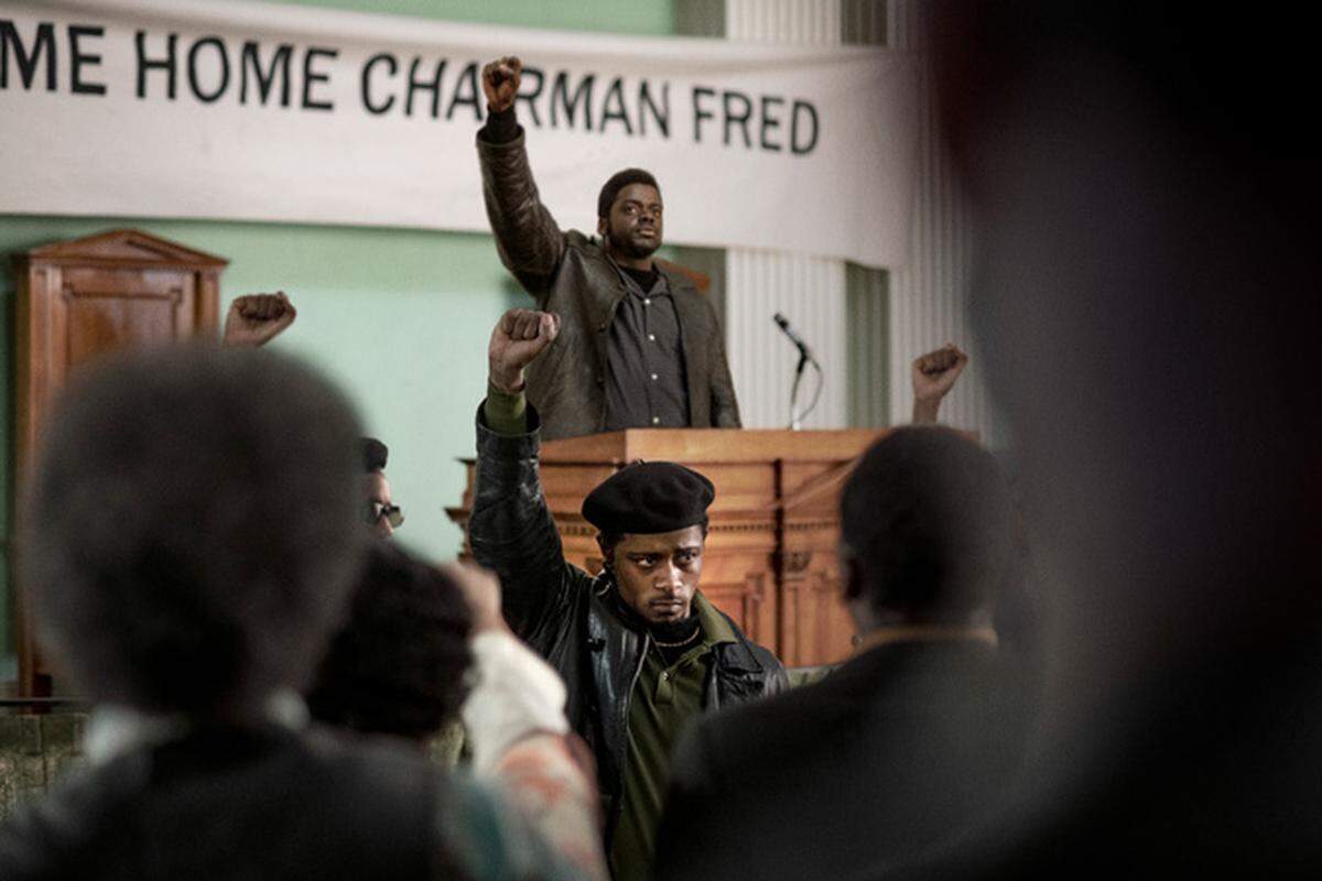 LaKeith Stanfield, foreground center, and Daniel Kaluuya, background center, in a scene from “Judas and the Black Messiah.”