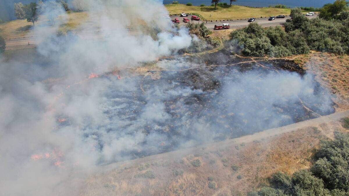 A fire burned about two acres in Columbia Park on Monday morning.