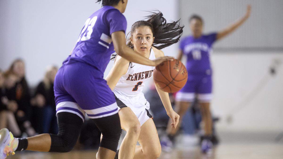 Kennewick defender Avery Fiander faces off against Garfield point guard Kareyna Taylor during Wednesday night’s opening-round game of the WIAA 3A girls state basketball tournament in the Tacoma Dome.