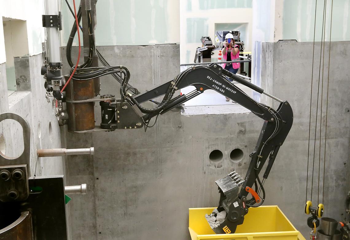 Workers have been practicing using remote-operated equipment at a mock-up of the 324 Building to prepare to dig up highly radioactive waste.