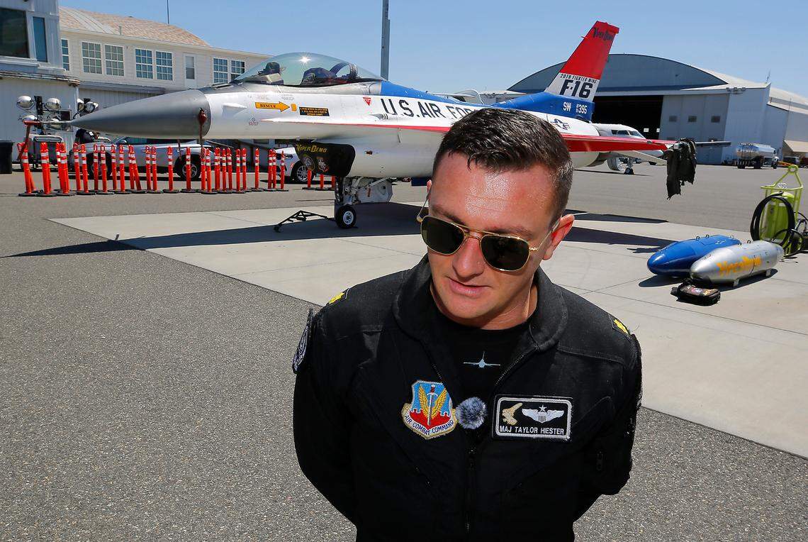 Maj. Taylor Hiester, a commander and pilot for the U.S. Air Force F-16 Viper Demonstration Team., talks about air show events after landing at the Tri-Cities Airport in Pasco.