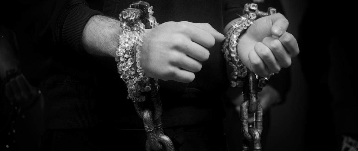 Diamonds are shown as handcuffs in Nobi’s new music video for the song “New Chains.” The song delves into how modern consumerism and the private prison system are forms of oppression.