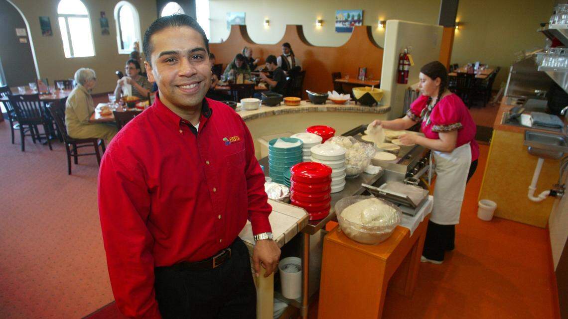 Isidro Ortiz opens the third Fiesta Mexican Restaurant Wednesday at Queensgate Drive in Richland.