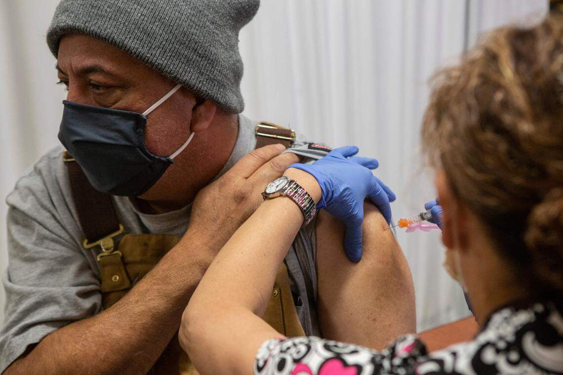 Benito Diaz, 54, Pasco receives his COVID-19 vaccination at Tri-Cities Community Health in Pasco.