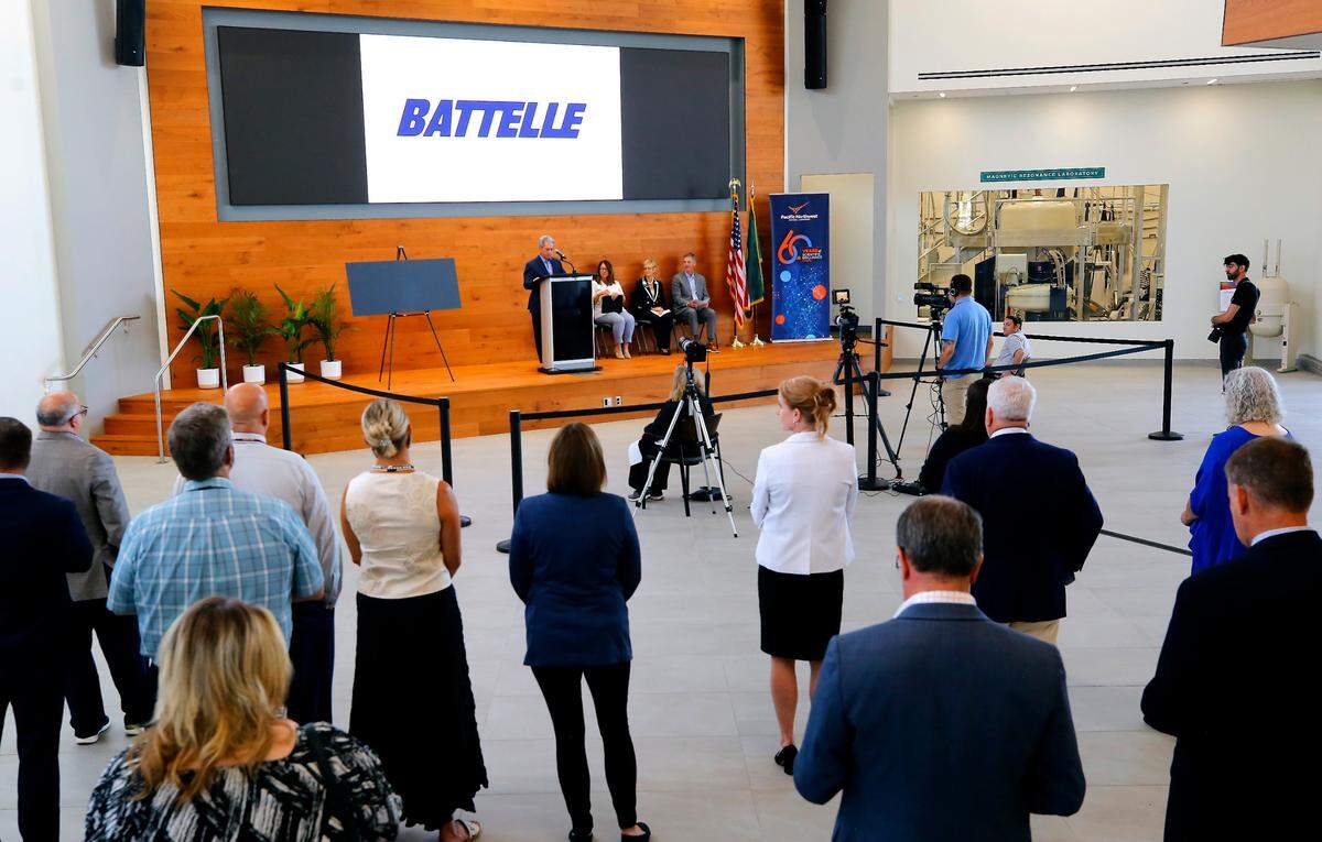 A crowd of about 35 people gather Wednesday morning for the ceremonial presentation of a $3.35 million philanthropic gift to Columbia Basin College to establish a Community STEM Learning Center on the college’s Pasco campus.