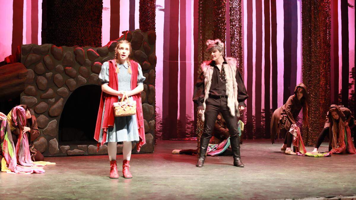 Megan Hatley and Chase Peterson perform at Red Riding Hood and the Wolf in Hanford Drama’s production of “Into the Woods.” The play opens Friday night and runs for the next two weekends.