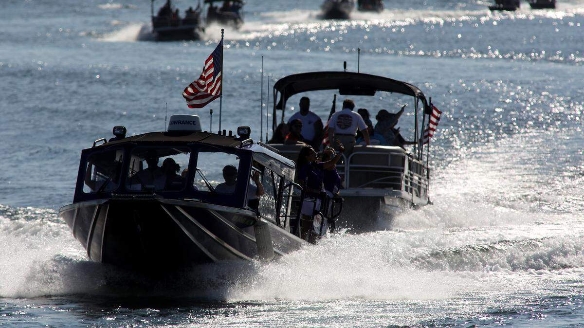 Water Follies tow boats, patrol boats and rescue sled take part in the annual opening ceremony parade lap in 2023 along both the Benton and Franklin County shorelines of the Columbia River for the Columbia Cup hydroplane racing event.