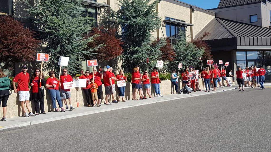 Kennewick teachers rally Thursday at the school district office.