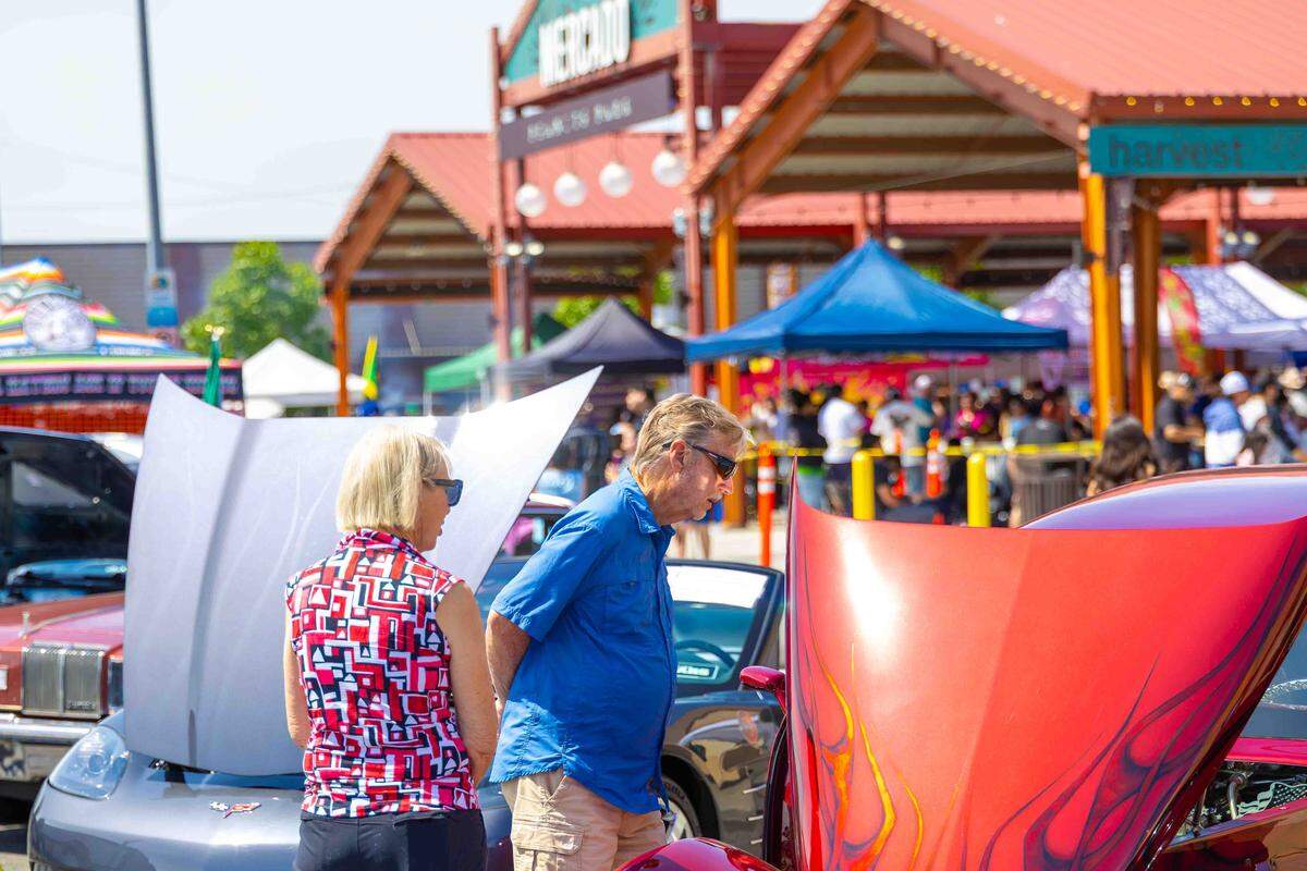 Spectators look over vintage automobiles during the car show at Peanuts Park during Pasco’s Cinco de Mayo celebration on Saturday in downtown Pasco.