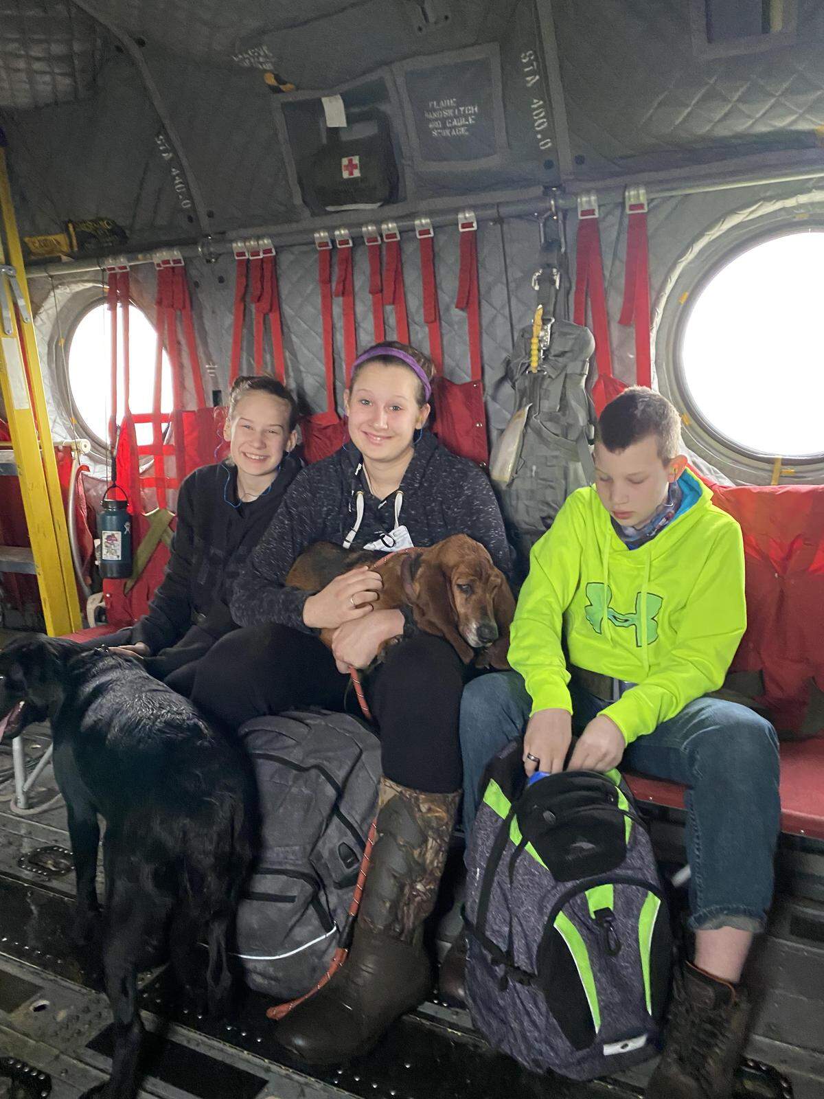McKenna Stempson, 13, Megan Stempson, 15, and Marcus Stempson, 12, were evacuated from their home on the flooded Bar M Ranch by Oregon Army National Guard helicopter.