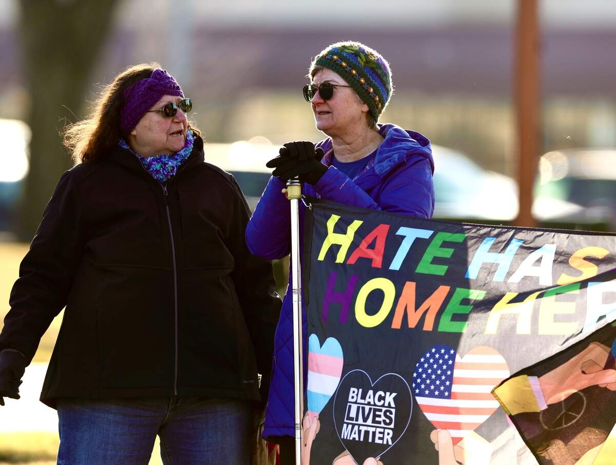 About 120 protesters waved signs at drivers along George Washington Way at John Dam Plaza in Richland on Sunday after the weekend killing of Alex Pretti, a nurse in Minneapolis, by immigration agents.