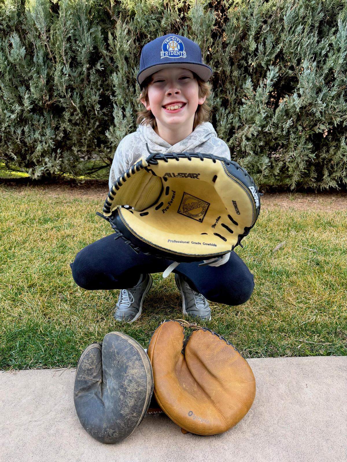A collection of very old baseball mitts, two almost a hundred years old.