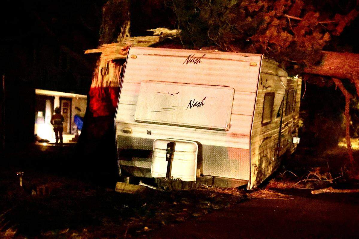 A tree crushed a travel trailer at a home near Grosscup Boulevard and N. 61st Street in West Richland, after strong winds swept through the Tri-Cities early Wednesday. Emergency crews responded around 3 a.m. as power lines were damaged and nearby residents were notified of extended outages.