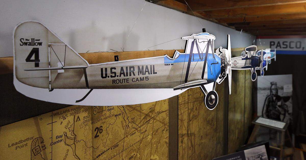 A cutout model of the Swallow biplane used for the first ever Air Mail flight has from the rafters as part of the Pasco Airmail Centennial Exhibit at the Pasco Aviation Museum. 