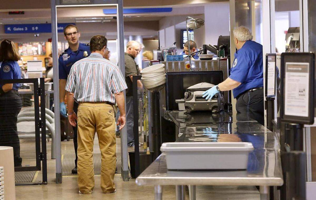 Transportation Security Administration officers screen airline passengers and their carry-on luggage departing from the Tri-Cities Airport in Pasco.