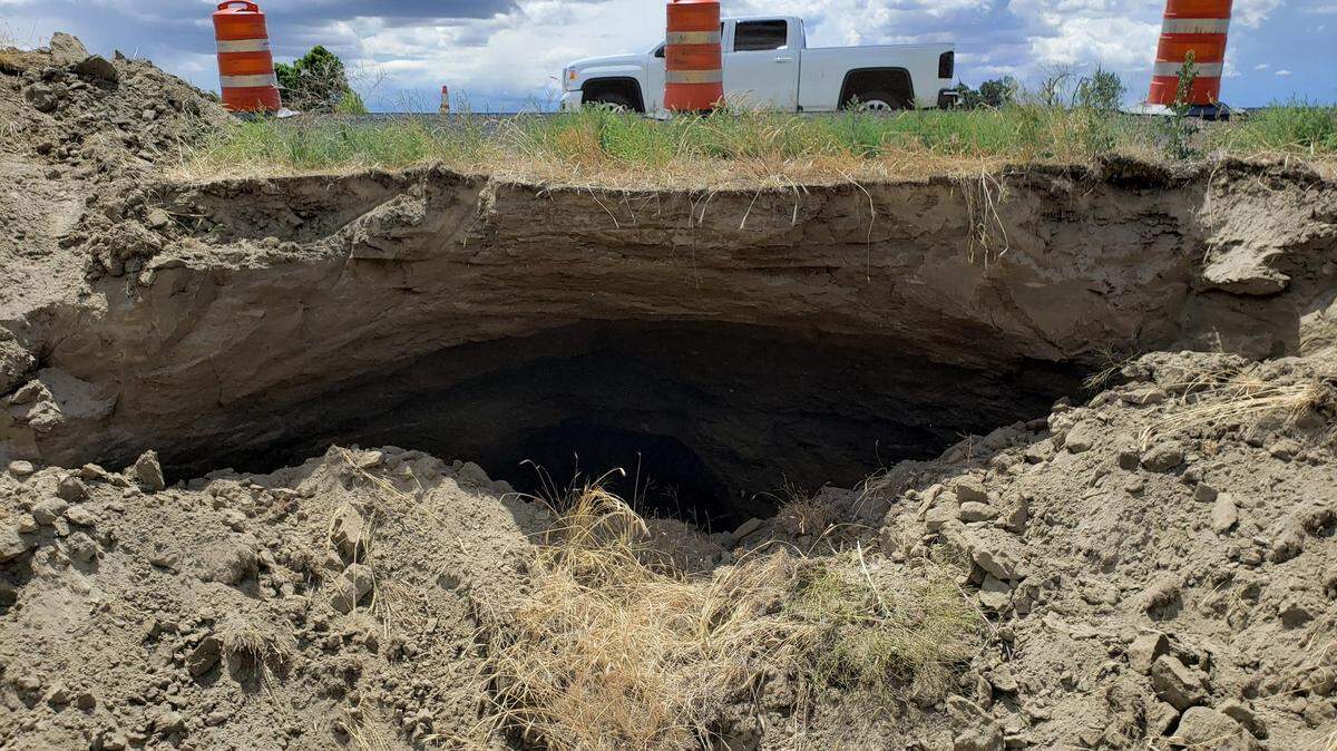 A sinkhole measuring about 15-feet deep and 30-feet wide closed I-82 eastbound lanes west of Prosser at milepost 54 near Zillah.