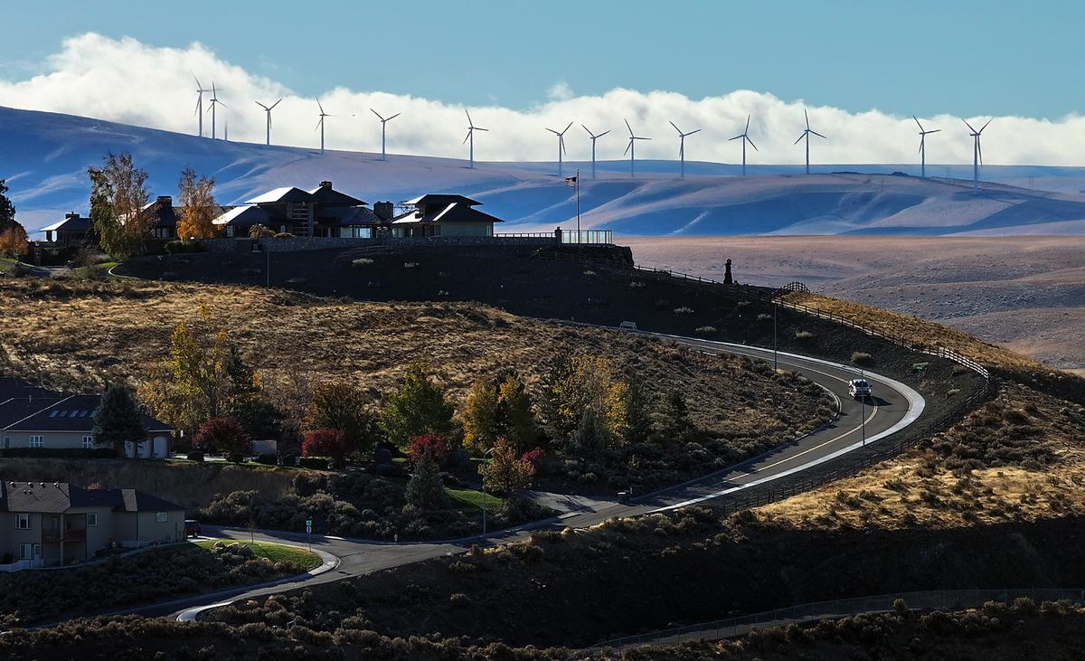 Clouds glide past the wind turbines on the hills south of Kennewick. The Horse Heaven wind farm project would stretch an additional 24 miles along the hills south of Kennewick.