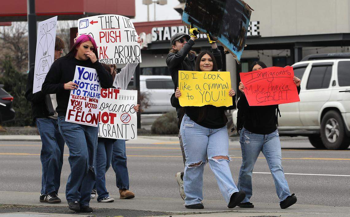 High school students walk eastbound on  West Court Street at North 32nd Avenue Friday afternoon during a protest march against Immigration & Customs Enforcement in Pasco.