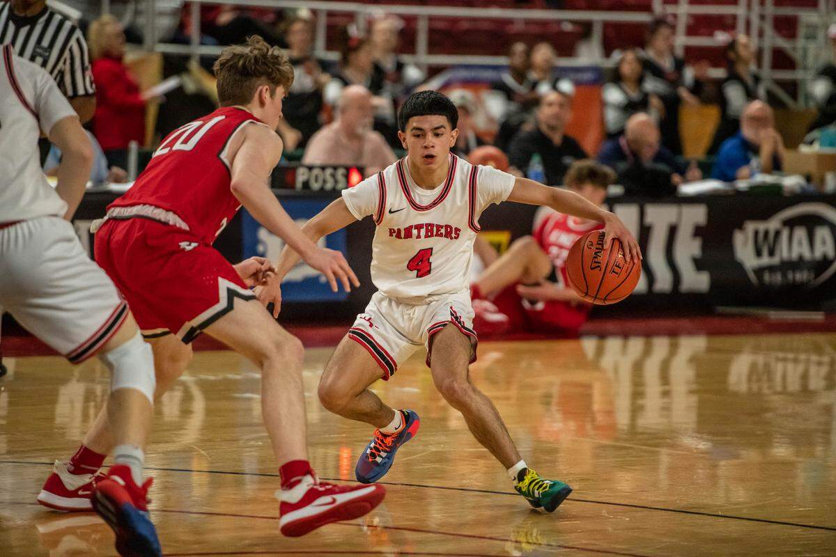 Mark Rocha of River View executes a nice behind-the-back ball handling against Will Pohland of King’s Knights