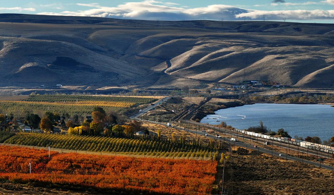 Traffic streams along on Highway 12 past Wallula and colorful orchards along the Columbia River towards the Wallula Junction in Walla Walla County.