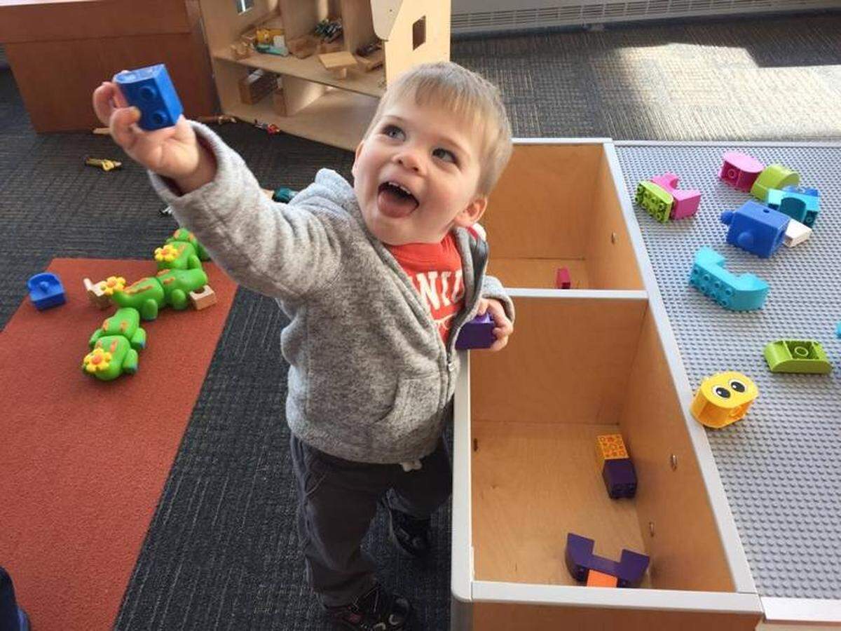 David Schreiber had fun playing at the public library in Deerfield, Ill., during a family visit for Thanksgiving 2015. His parents were inspired by that visit to donate interactive panels and activity tables to the Richland Public Library after his death the following year.