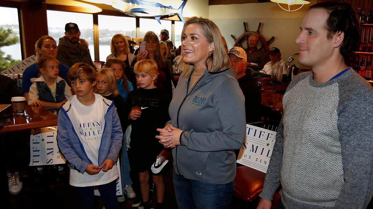 Nov. 2022 FILE PHOTO — U.S. Senate Candidate Tiffany Smiley stands next to her husband, Scotty, as they are surrounded by family, friends and supporters during her New Mom in Town Tour stop at the Clover Island Inn in Kennewick.