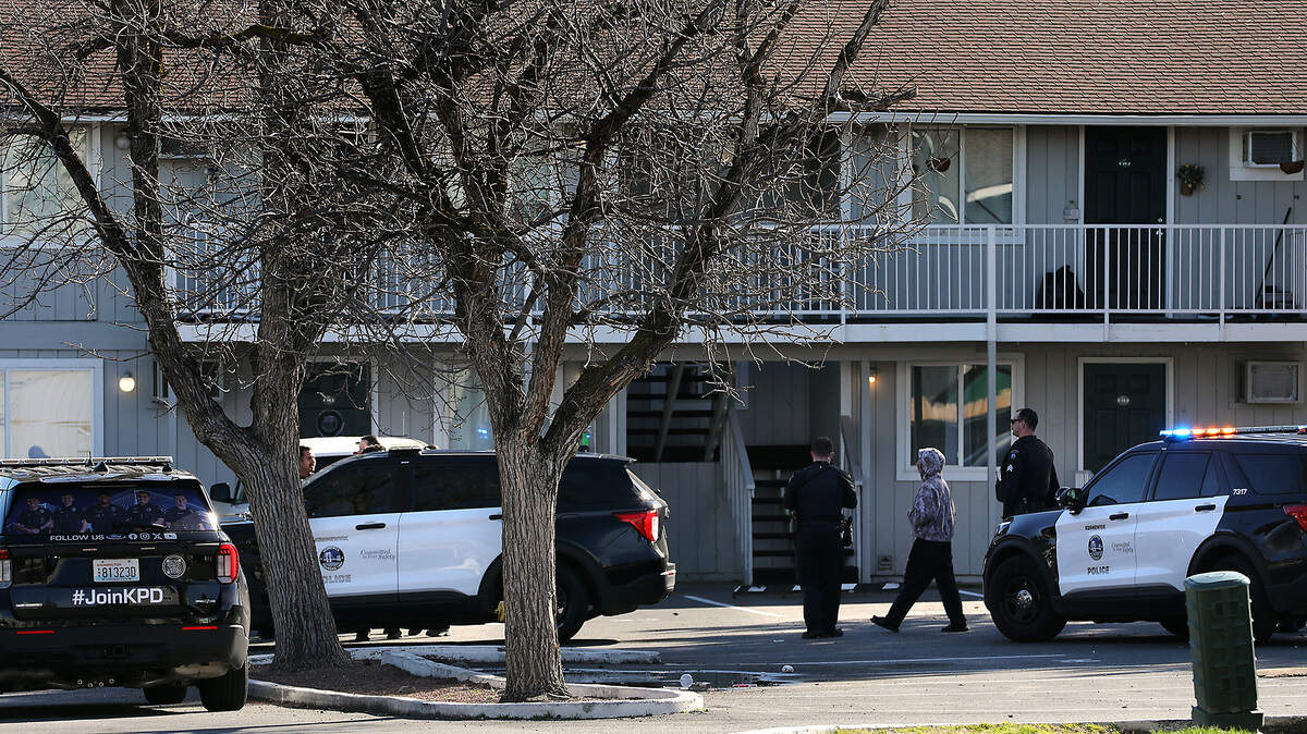 Kennewick Police officers investigate the report of a teen brandishing a handgun Thursday morning on the 700 block of North Arthur Street, across the street from Kamiakin High School.
