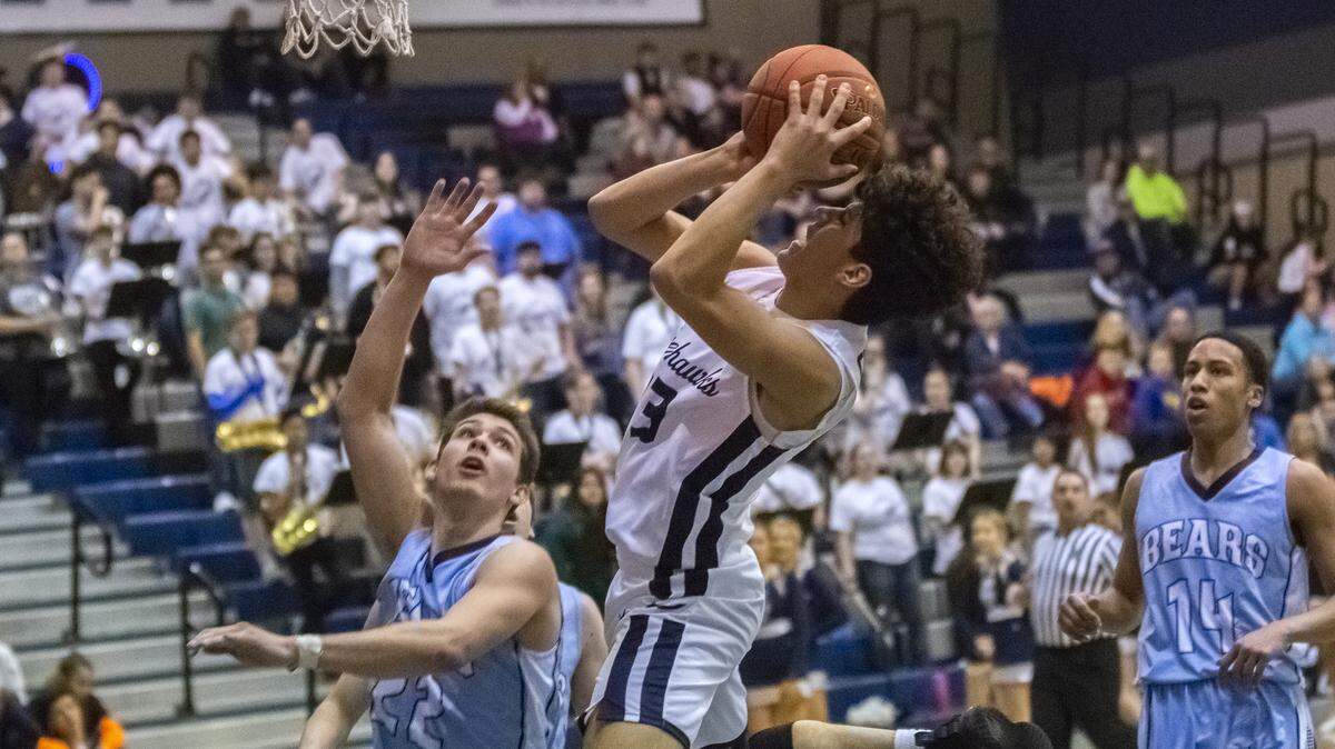Chiawana’s Jayden Martinez (23) takes a shot and scores during a District 8 4A playoffs against Central Valley on Monday played at Chiawana High School in Pasco. Chiawana won 88-74