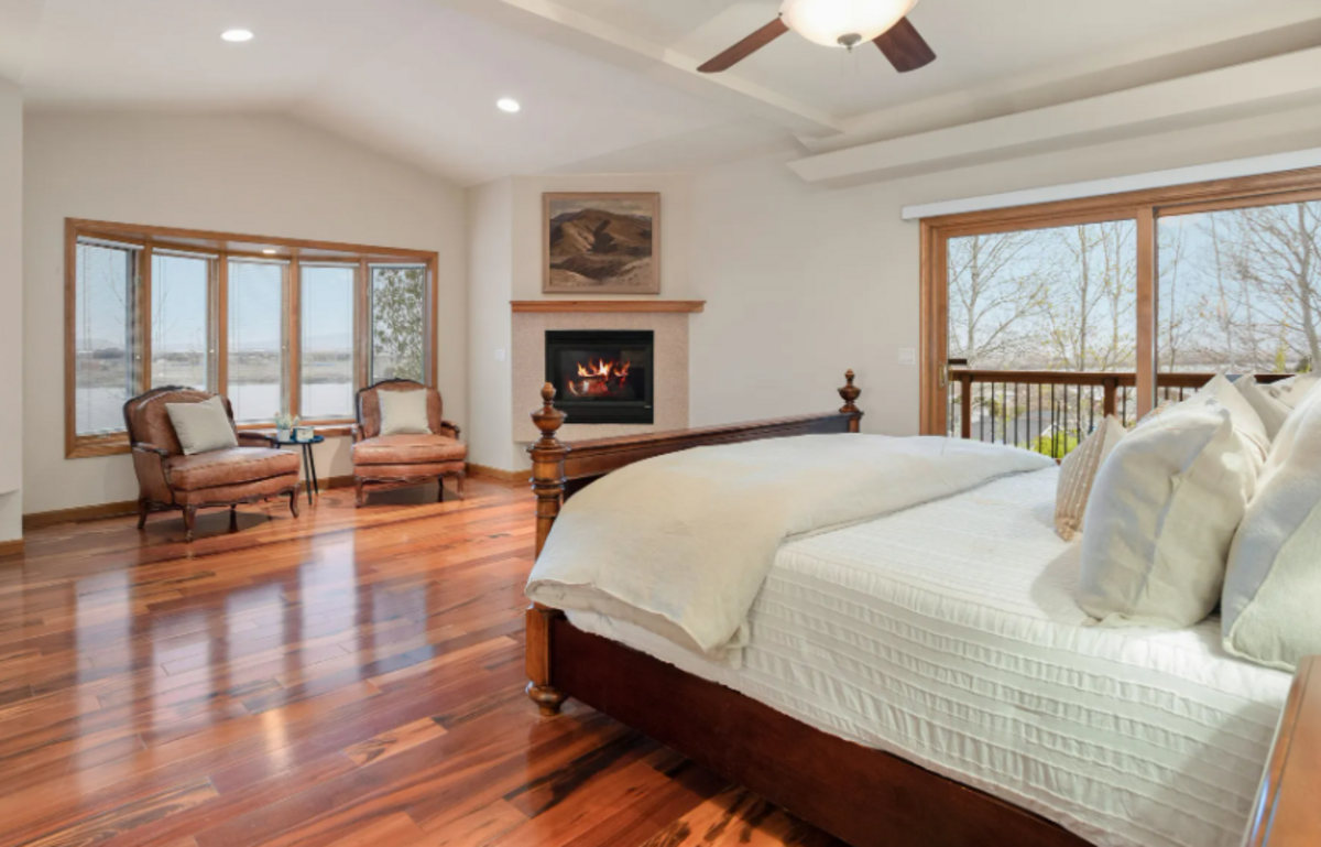 The master bedroom has a fireplace and sweeping views.